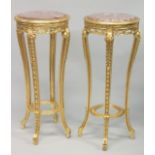 A PAIR OF FRENCH STYLE GILTWOOD AND MARBLE TALL CIRCULAR STANDS. 3ft 8ins high x 1ft 6ins diameter.