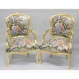 A PAIR OF FRENCH STYLE TAPESTRY UPHOLSTERED GILT WOOD OPEN ARMCHAIR.