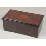 A SMALL 19TH CENTURY SWISS MUSICAL BOX the top with floral inlay. 11.5ins long.