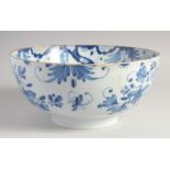 AN 18TH CENTURY DELFT BLUE AND WHITE CIRCULAR PUNCH BOWL. 11ins diameter.