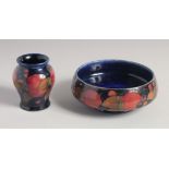 WILLIAM MOORCROFT POMEGRANATE CIRCULAR BOWL on a blue ground. W. M. initials, impressed,