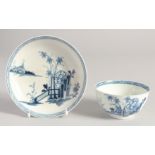 A LIVERPOOL TEABOWL AND SAUCER painted in blue with the Peony Bamboo and Fence pattern.