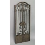 A WROUGHT IRON FOLDING MIRROR. 4ft 3ins high x 3ft 4ins wide when open.