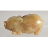 A CARVED RUSSET JADE PIG. 2.25ins long.