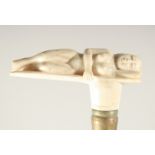 A CARVED BONE HANDLE WALKING STICK "NUDE".