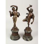 AFTER THE ANTIQUE. A GOOD PAIR OF 19TH CENTURY BRONZES OF DANCING CLASSICAL FIGURES on circular
