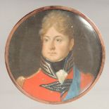 A CIRCULAR PORTRAIT OF A GENTLEMAN, probably WILLIAM IV, in a red coat. 2.24ins x 2.25ins.