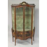 A GOOD LARGE 19TH CENTURY FRENCH LOUIS XV DESIGN SERPENTINE FRONTED VITRINE with rich ormolu mounts,