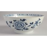 A LIVERPOOL BOWL painted with a large peony in blue.