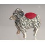 A SILVER RAM PIN CUSHION.