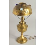 AN ART DECO GILT METAL LAMP set with three coloured stones. 12.5ins high.