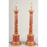 A PAIR OF TOLEWARE LAMPS with Chinese design. 24ins high with electric fittings.