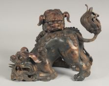 A GOOD CHINESE BRONZE FO DOG CENSER with two entwined dogs. 8ins high.