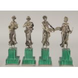 A SUPERB SET OF FOUR SILVER CLASSICAL FIGURES ON MALACHITE BASES. Mark: head 84, Faberge mark. 7.