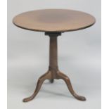 A GEORGE III MAHOGANY CIRCULAR TOP TRIPOD TABLE with bird cage support. 68cm diameter, 69cm high.