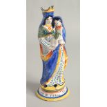 A MAJOLICA POTTERY FIGURE "Ste. VIERGE". 9.5ins high.