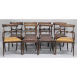 A SET OF EIGHT LATE REGENCY MAHOGANY DINING CHAIRS, two with arms, all with panelled cresting rails,