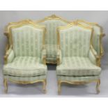 A FRENCH STYLE GILTWOOD THREE PIECE SUITE, comprising three seater settee and a pair of matching