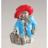 A SILVER AND ENAMEL PADDINGTON BEAR BROOCH.