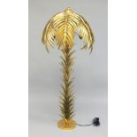 A FLOOR STANDING LAMP modelled as a gilt metal palm tree. 5ft 3ins high.
