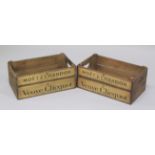 A PAIR OF WOODEN "CHAMPAGNE" STORAGE CRATES. 1ft 5ins long.