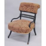 AN AESTHETIC MAHOGANY ARMCHAIR with black frame.