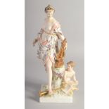 A BERLIN PORCELAIN FIGURE OF A MUSE carrying a lyre, a cupid at her feet. Mark in blue. 12ins high.