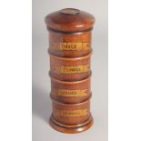 A POLISHED WOOD SPICE TOWER. 7.5ins high.