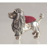A SILVER POODLE PIN CUSHION.