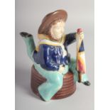 A MINTON MAJOLICA ISLE OF MAN THREE LEGGED SAILOR TEA POT AND COVER with brown hat and fashioning