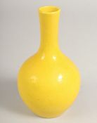 A SMALL CHINESE YELLOW VASE. Mark in blue. 7ins high