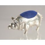 A SILVER HOG PIN CUSHION.