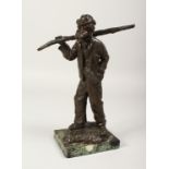 CHARLES-EMILLE JONCHERY. A GOOD BRONZE OF AN OLD MAN CARRYING A STICK OVER HIS SHOULDER. Signed.