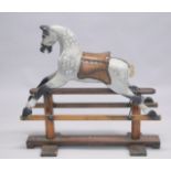 A VICTORIAN PAINTED WOOD ROCKING HORSE. 2ft 8ins high.