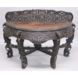 A 19TH CENTURY BURMESE CARVED HARDWOOD DEMI-LUME CONSOLE TABLE, with carved and pierced upstand