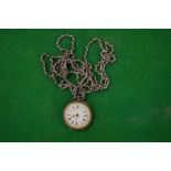 A ladies' silver pocket watch with enamel dial and long curb link chain.