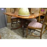 A mahogany tilt-top breakfast table.