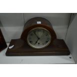 A mahogany mantel clock.