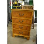 A small yew wood four drawer chest.