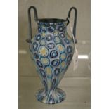 A Roman style molded glass twin handled vase.