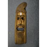 A carved wood mask.