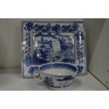 Chinese blue and white cup and a rectangular blue and white dish.