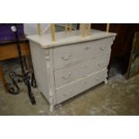 A painted three drawer chest.