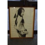 Female semi nude dressed as a native American, black and white photographic print.