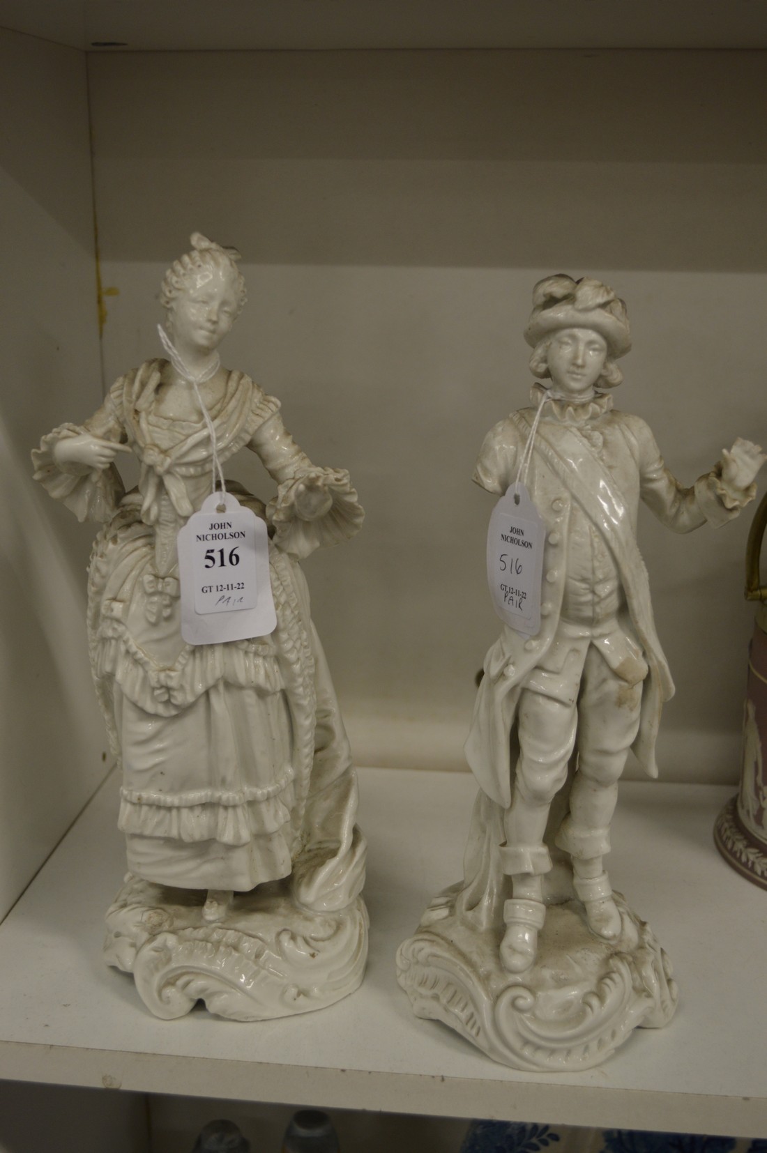 A pair of blanc de chine figures of a man and woman (af).