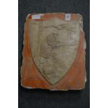 J Brookes, a shield shaped plaster picture of a fisherman, signed and dated 1948.