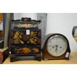 Japanese lacquer table top cabinet and a mantel clock.