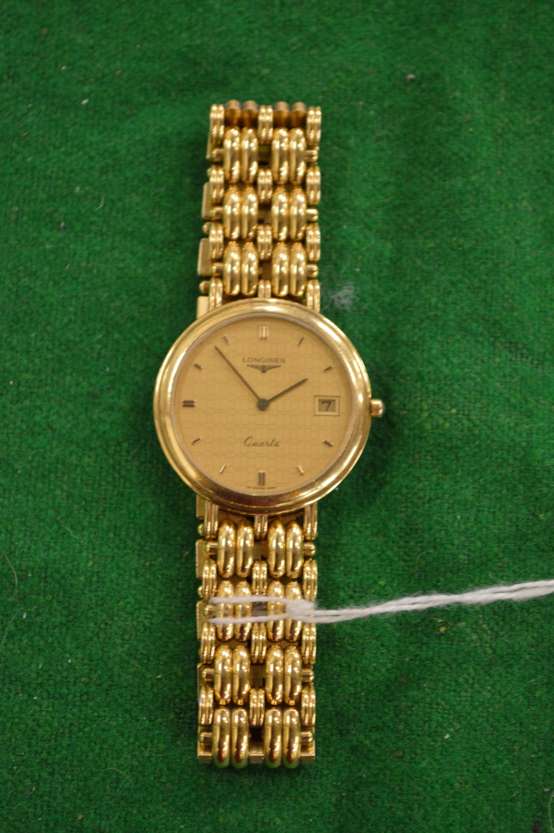 A gentlemen's Longines quartz wrist watch with bracelet strap.