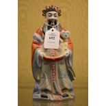 A Chinese figure of an emperor.