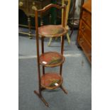 A chinoiserie decorated three tier folding cake stand.